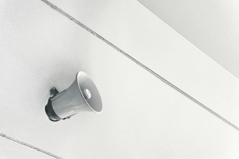 Gray megaphone on white surface photo